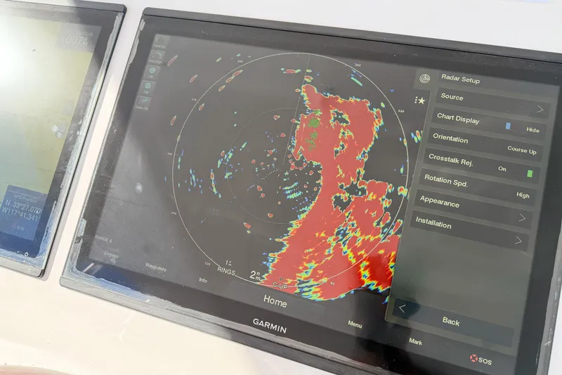 Slide: The Image of Garmin radar display on 2013 Viking 46 Convertible boat, showing navigation data. - 45