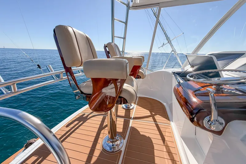 Slide: The Image of Luxurious 2013 Viking 46 Convertible yacht helm with ocean view and elegant seating. - 48