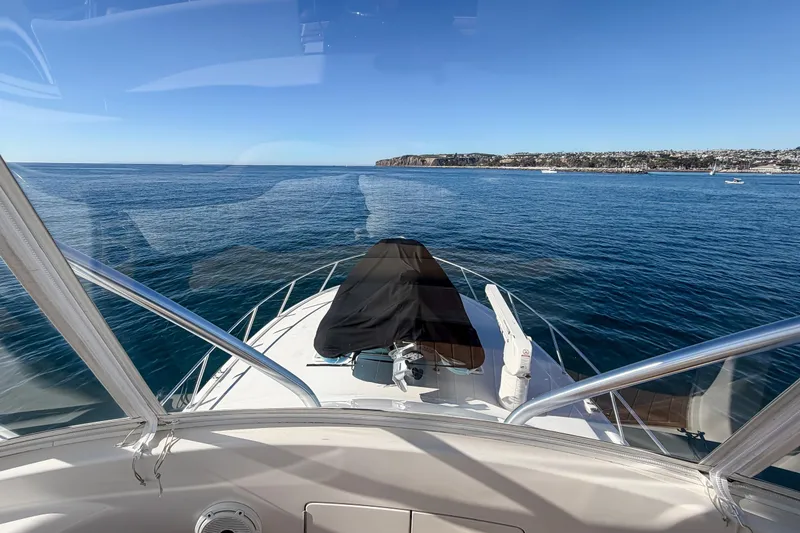 Slide: The Image of View from 2013 Viking 46 Convertible yacht, overlooking calm ocean and distant coastline. - 50