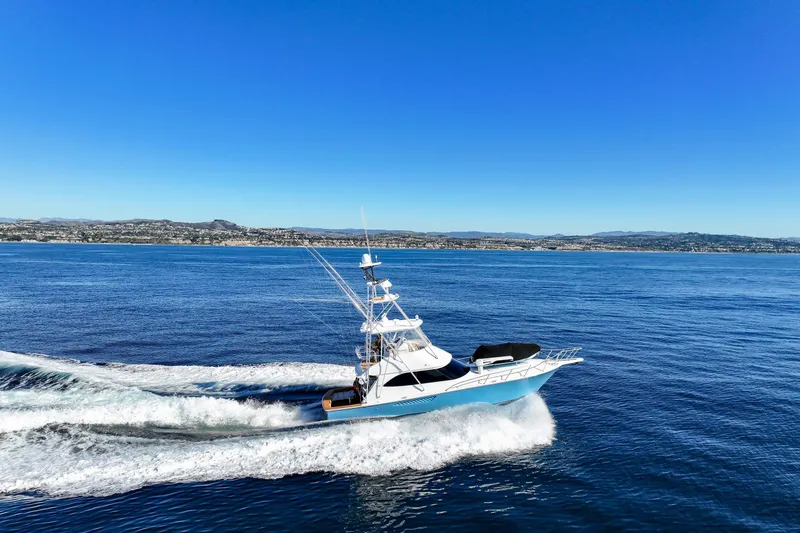 Slide: The Image of 2013 Viking 46 Convertible yacht cruising on open blue sea. - 69