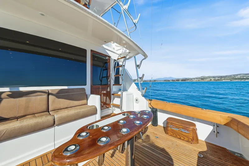 Slide: The Image of 2013 Viking 46 Convertible yacht deck with seating and ocean view. - 8