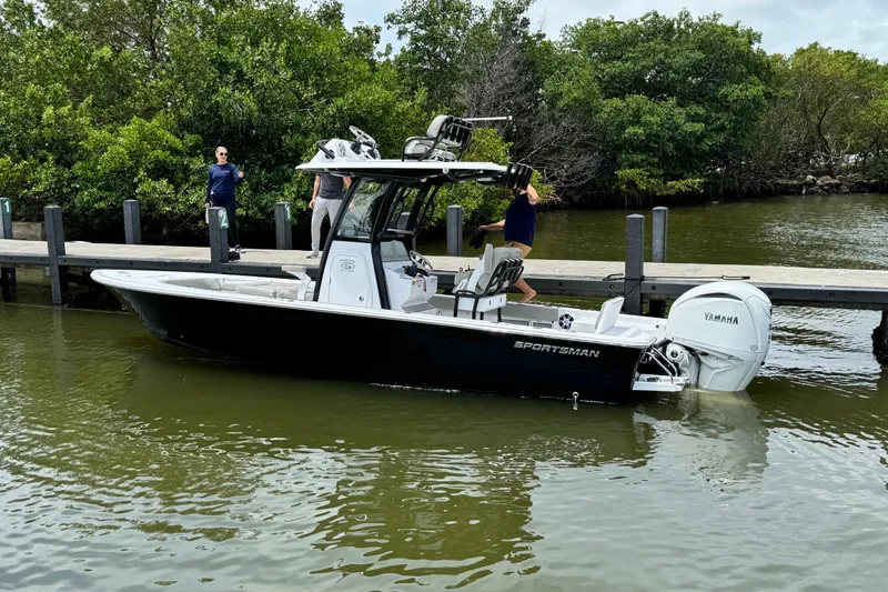 Slide: The Image of 2024 Sportsman Masters 247OE Bay Boat docked with Yamaha engine. - 1