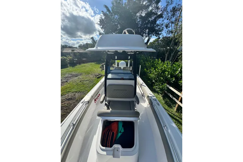 Slide: The Image of 2024 Sportsman Masters 247OE Bay Boat, sleek design, spacious deck, outdoor setting. - 14