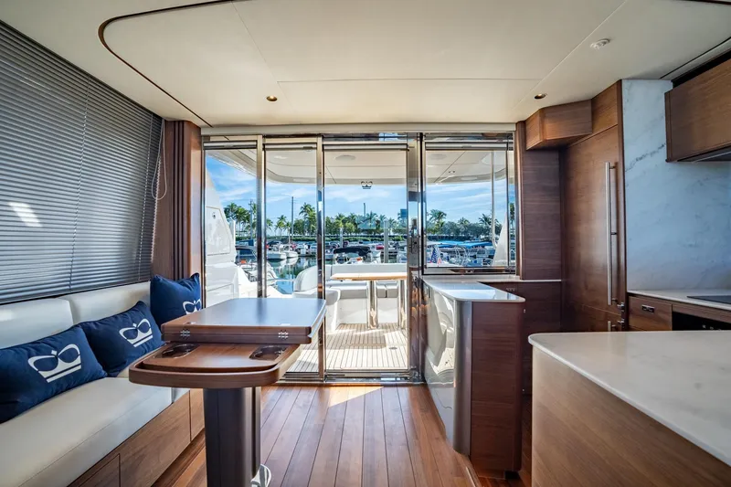 Slide: The Image of Luxurious 2026 Princess F58 yacht deck with elegant seating and marina view. - 18