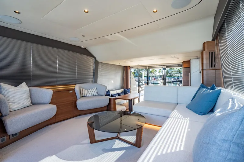 Slide: The Image of Luxurious interior of 2026 Princess F58 yacht with elegant wood finishes and marina view. - 19