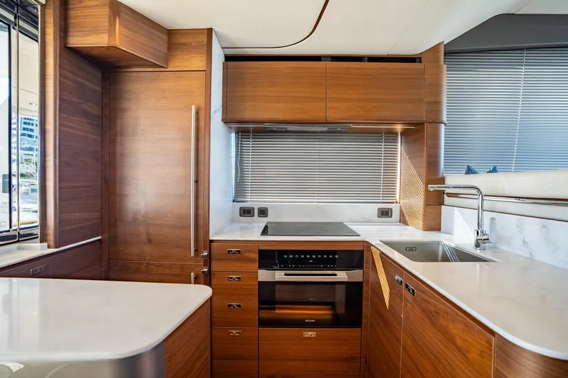 Slide: The Image of Luxurious interior of 2026 Princess F58 yacht with modern kitchen and marina view. - 22