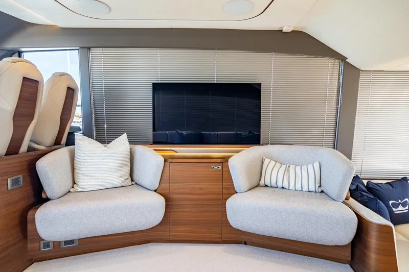 Slide: The Image of Luxurious interior of 2026 Princess F58 yacht with modern seating and navigation area. - 24