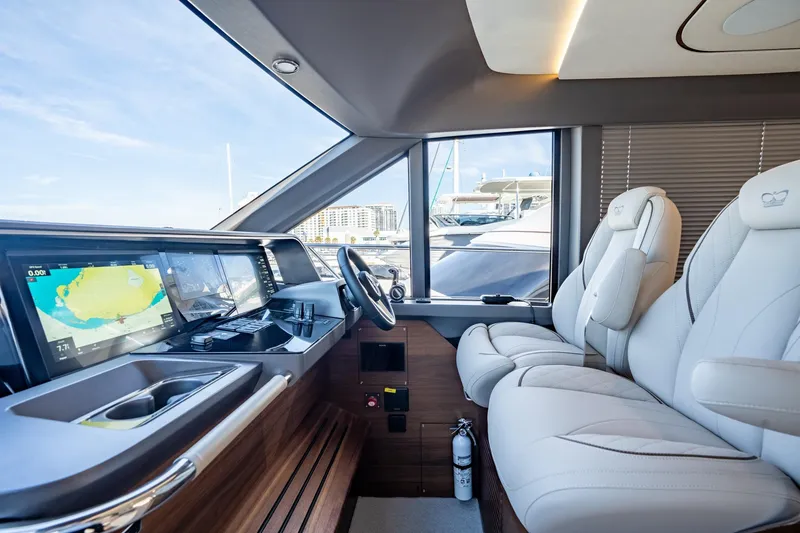 Slide: The Image of Helm of 2026 Princess F58 yacht with advanced navigation displays and controls. - 26