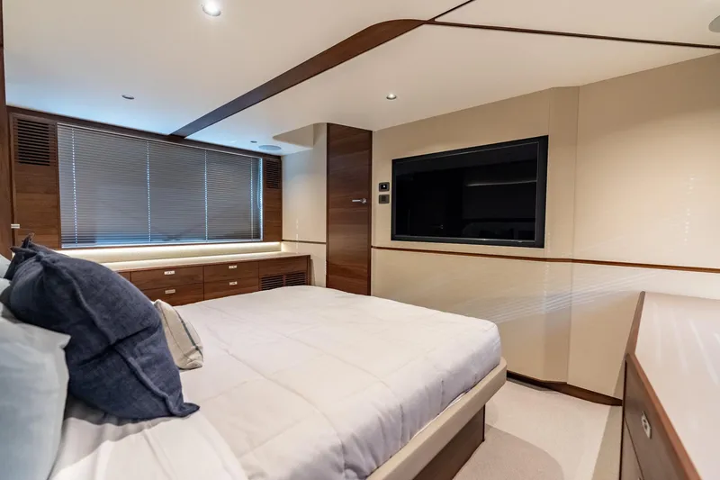 Slide: The Image of Luxurious bedroom interior of 2026 Princess F58 yacht with modern design and plush bedding. - 34