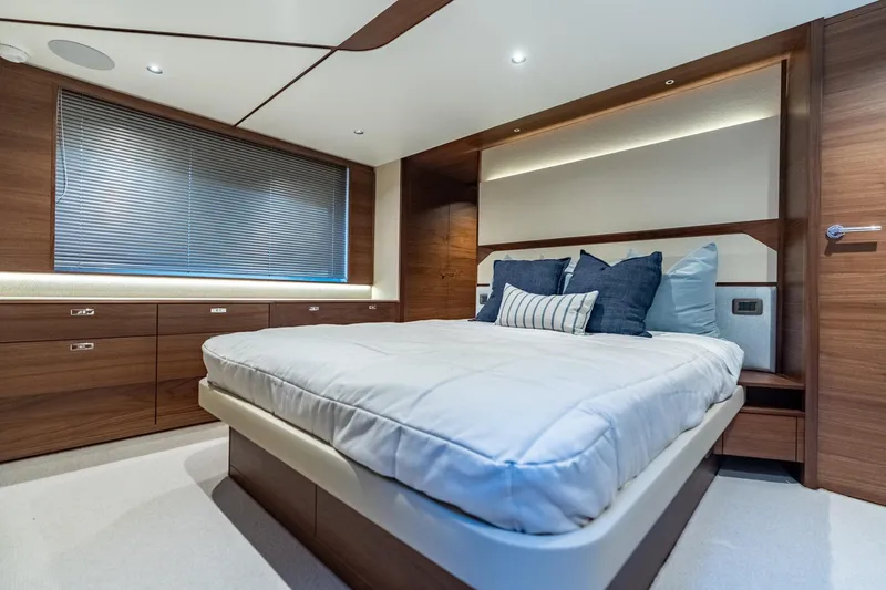 Slide: The Image of Luxurious bedroom interior of 2026 Princess F58 yacht with modern design and cozy bedding. - 36