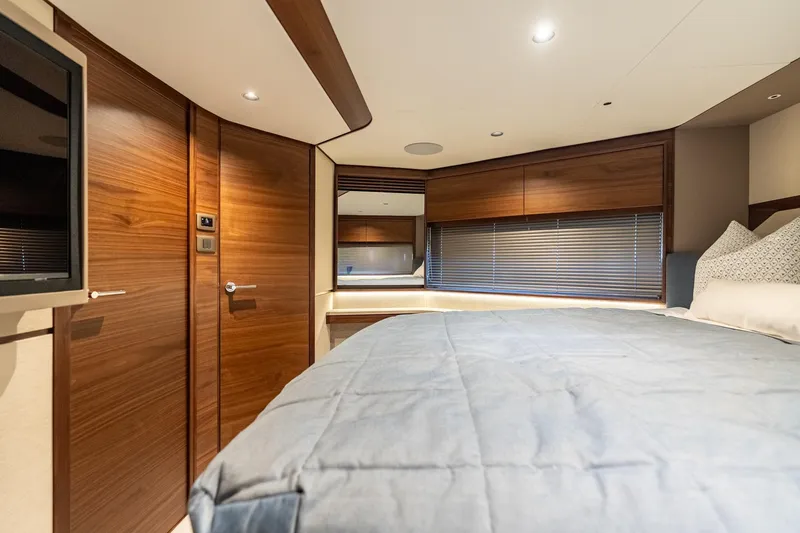 Slide: The Image of Luxurious cabin interior of 2026 Princess F58 yacht with twin beds and modern decor. - 39