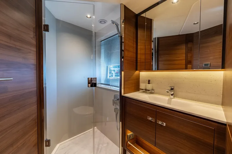 Slide: The Image of Luxurious interior of 2026 Princess F58 yacht with wood paneling and modern amenities. - 41