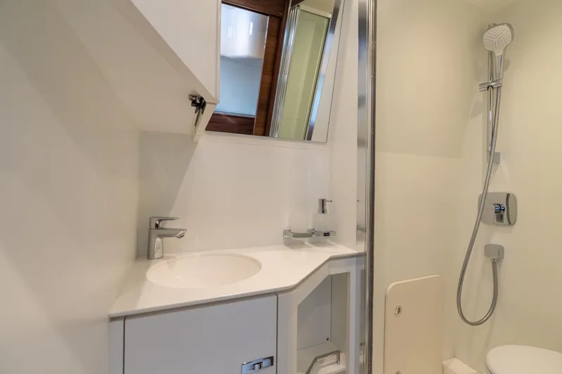 Slide: The Image of 2026 Princess F58 yacht cabin with wooden interior and single bed. - 44