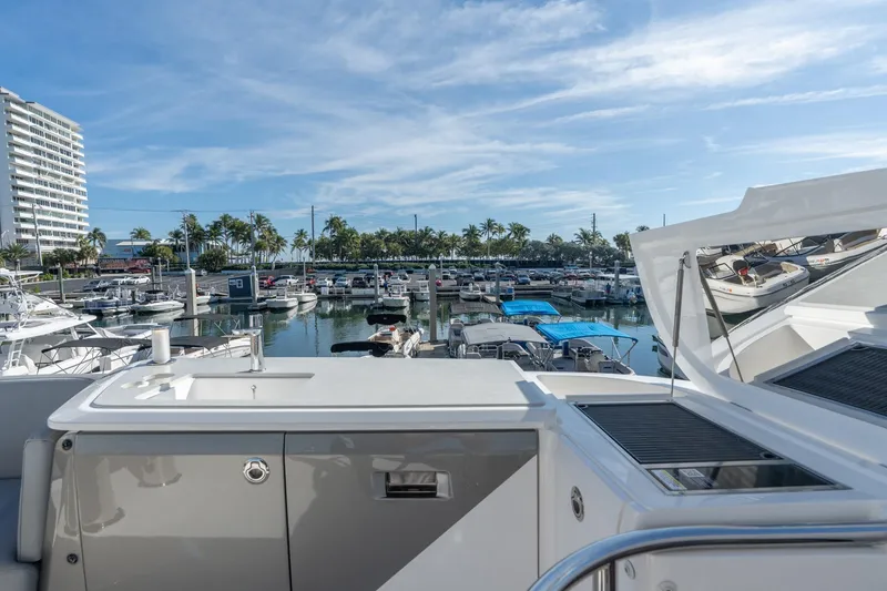 Slide: The Image of Helm of 2026 Princess F58 yacht with modern navigation systems, docked at marina. - 7