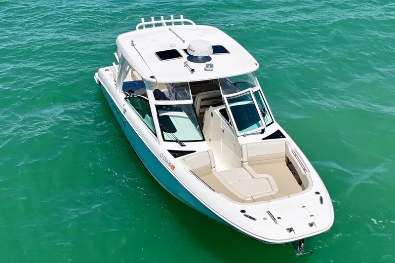 Slide: The Image of 2018 Boston Whaler 320 Vantage boat on clear turquoise water. - 27
