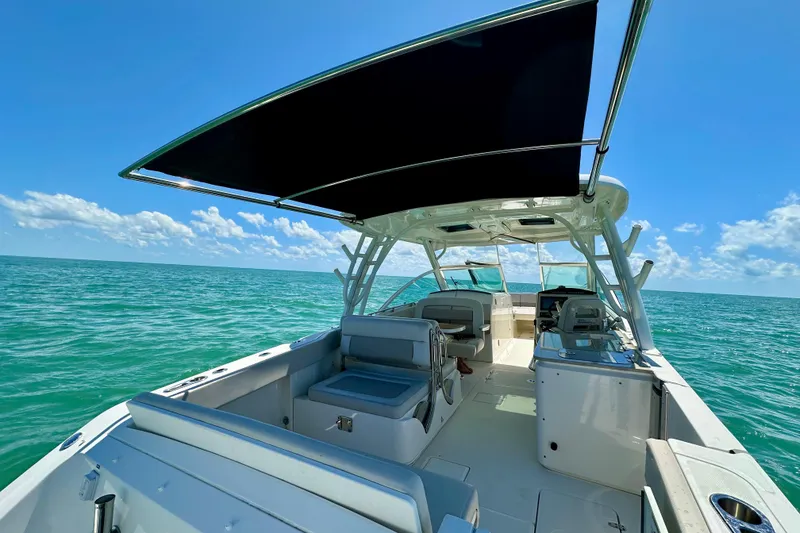 Slide: The Image of 2018 Boston Whaler 320 Vantage boat on open sea under clear blue sky. - 5
