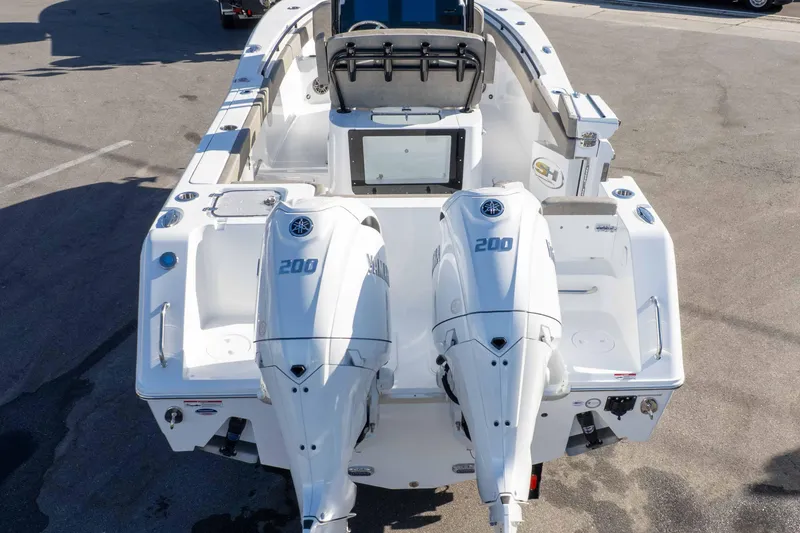 Slide: The Image of 2026 Sea Hunt Gamefish 25 boat with dual 200 horsepower engines, rear view. - 10