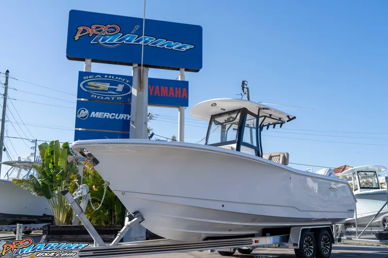 Slide: The Image of 2026 Sea Hunt Gamefish 25 boat displayed at Pro Marine dealership. - 11