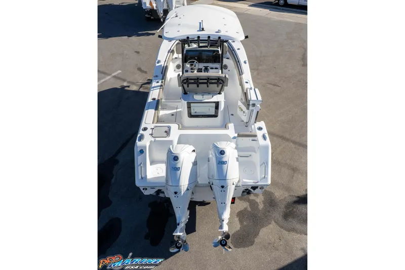 Slide: The Image of 2026 Sea Hunt Gamefish 25 boat with dual outboard engines, viewed from above. - 12