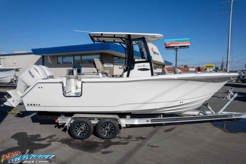 Slide: The Image of 2026 Sea Hunt Gamefish 25 boat on trailer, side view, sunny day. - 20