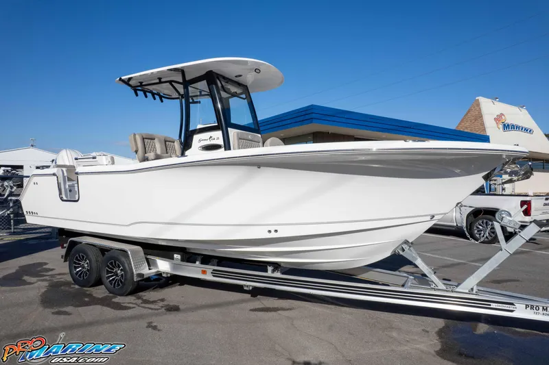 Slide: The Image of 2026 Sea Hunt Gamefish 25 boat on trailer at dealership. - 26