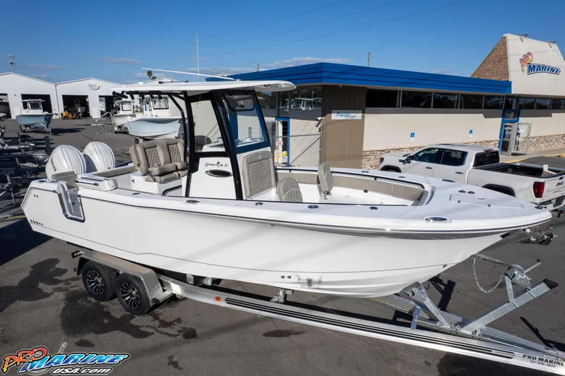 Slide: The Image of 2026 Sea Hunt Gamefish 25 boat on trailer at dealership, side view. - 28