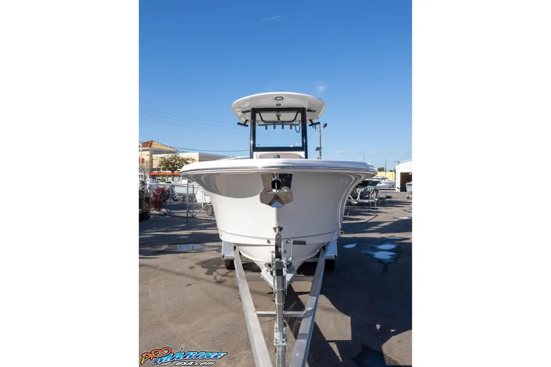Slide: The Image of 2026 Sea Hunt Gamefish 25 boat on trailer under clear blue sky. - 32