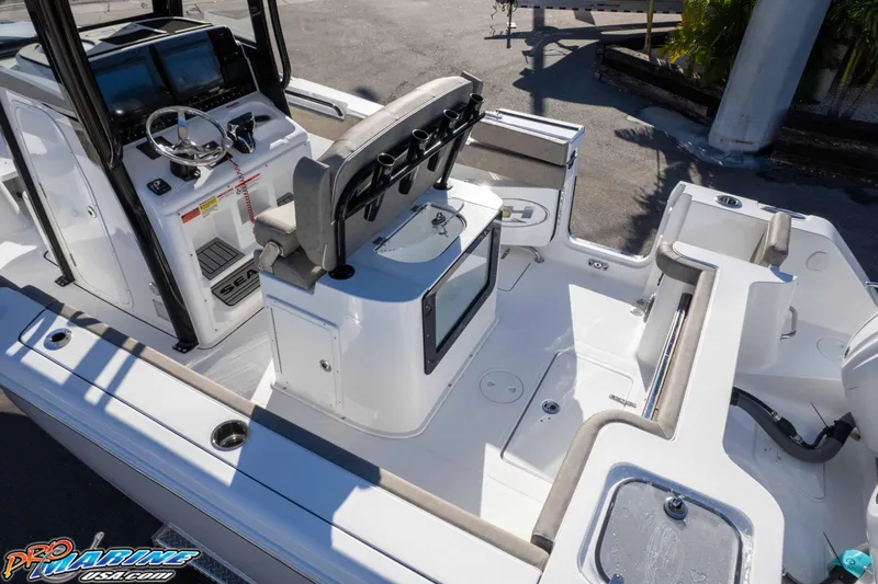 Slide: The Image of 2026 Sea Hunt Gamefish 25 boat interior with helm, seating, and storage compartments. - 40
