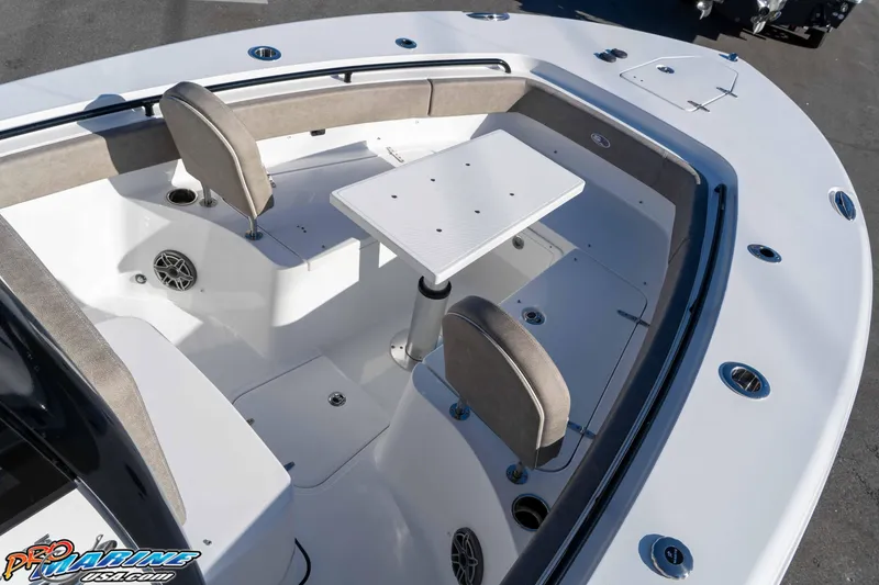 Slide: The Image of 2026 Sea Hunt Gamefish 25 boat interior with seating and table setup. - 55