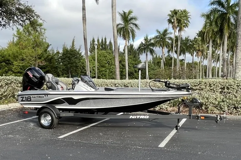 Slide: The Image of 2024 Nitro Z18 boat parked with palm trees in the background. - 1
