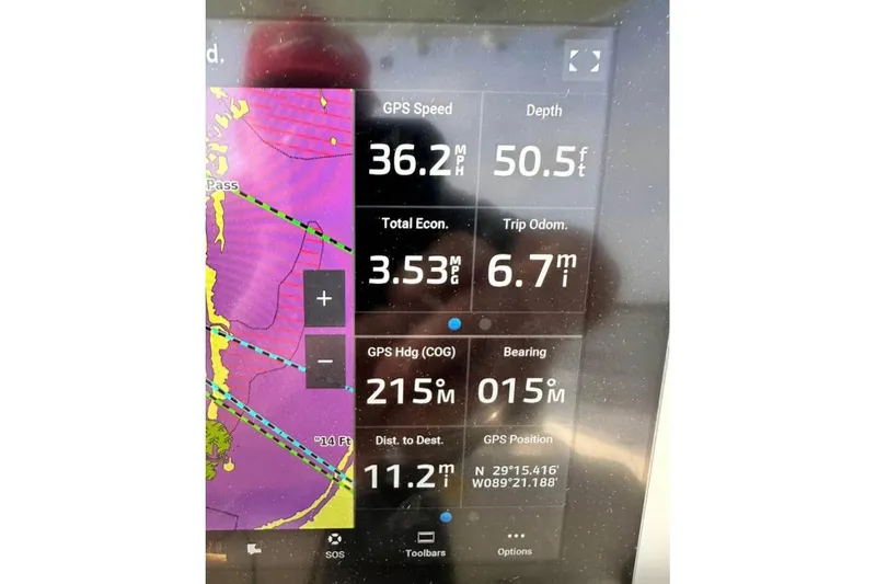 Slide: The Image of 2016 Pathfinder 2600 HPS boat with fishing gear on deck, navigating choppy waters. - 10