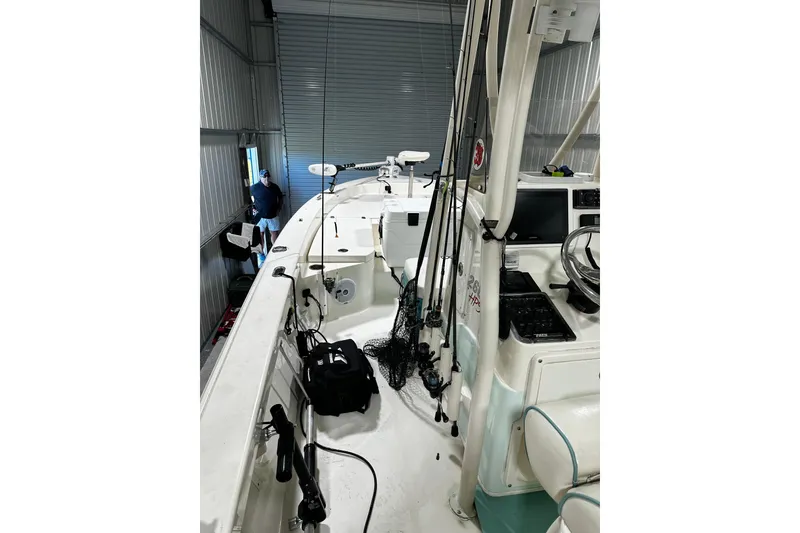 Slide: The Image of 2016 Pathfinder 2600 HPS boat in storage, equipped with fishing gear and electronics. - 17