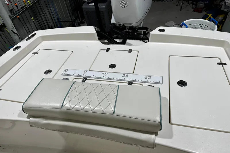 Slide: The Image of 2016 Pathfinder 2600 HPS boat deck with cushioned seat and measurement scale. - 20