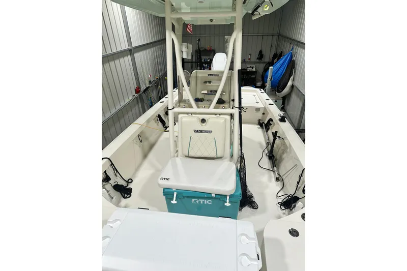 Slide: The Image of 2016 Pathfinder 2600 HPS boat interior with fishing gear and RTIC cooler. - 22