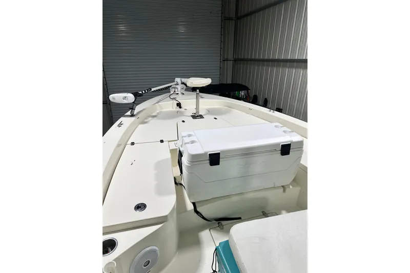 Slide: The Image of 2016 Pathfinder 2600 HPS boat interior with cooler and trolling motor in storage. - 23