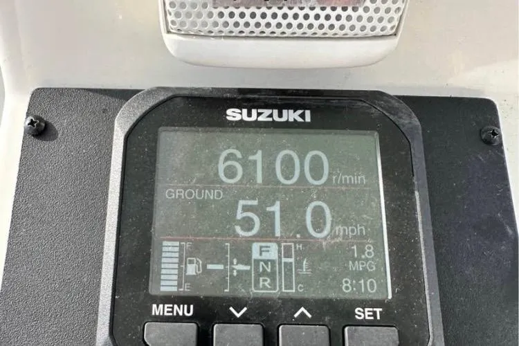 Slide: The Image of Suzuki display showing 6100 RPM, 51 mph on a 2016 Pathfinder 2600 HPS boat. - 24