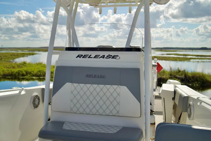 Slide: The Image of 2017 Release 240 RX boat interior with scenic water and sky background. - 10