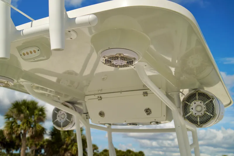 Slide: The Image of Boat canopy with speakers and lights, Release 240 RX, 2017 model, under blue sky. - 13