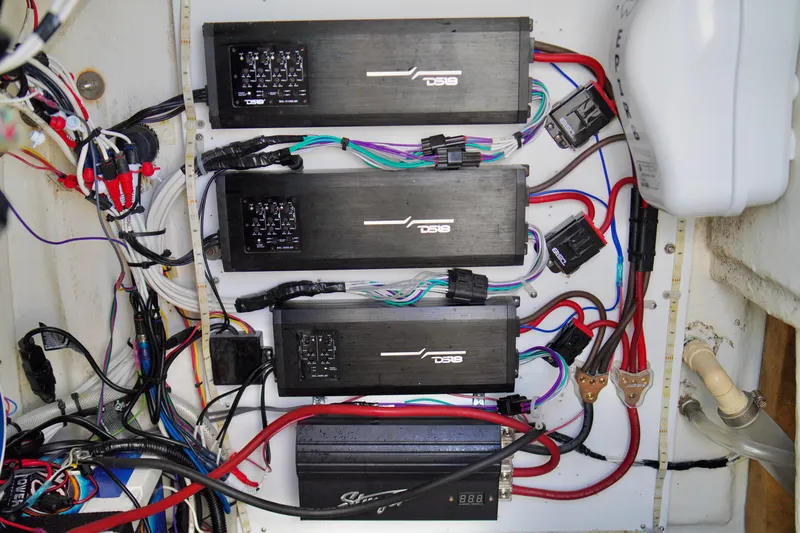 Slide: The Image of Electrical wiring and amplifiers setup in a 2017 Release 240 RX boat. - 18
