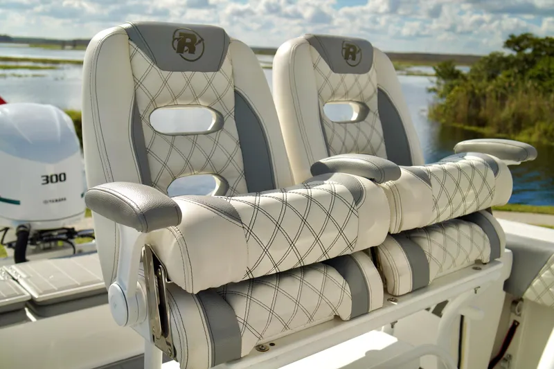 Slide: The Image of Luxury seating on 2017 Release 240 RX boat with scenic water backdrop. - 23