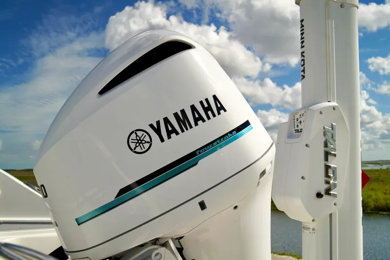 Slide: The Image of Yamaha outboard motor on a 2017 Release 240 RX boat, with blue sky background. - 31