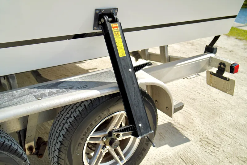 Slide: The Image of Trailer with Magic Tilt branding and 2017 Release 240 RX boat support. - 33