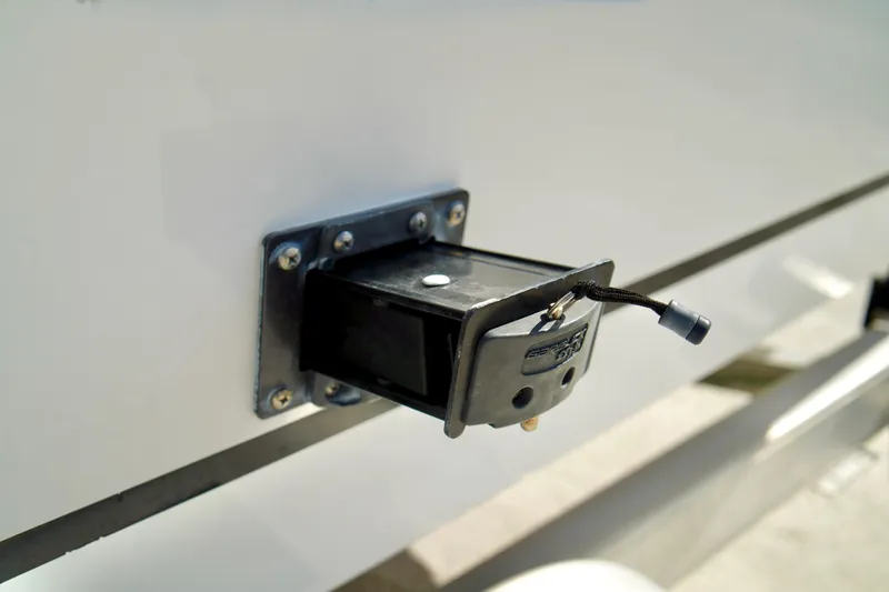 Slide: The Image of Trailer hitch receiver on a 2017 Release 240 RX boat, close-up view. - 34