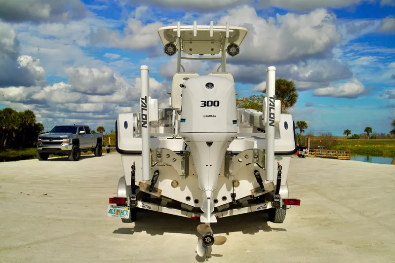 Slide: The Image of Boat with Yamaha 300 engine on trailer, Release 240 RX model, 2017, parked near truck. - 35