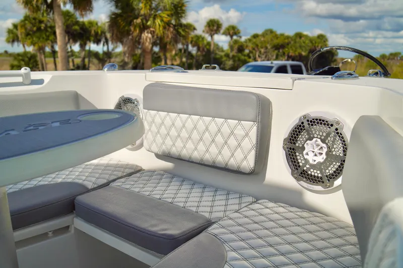 Slide: The Image of Luxurious seating on 2017 Release 240 RX boat with diamond-stitched upholstery and speaker system. - 7