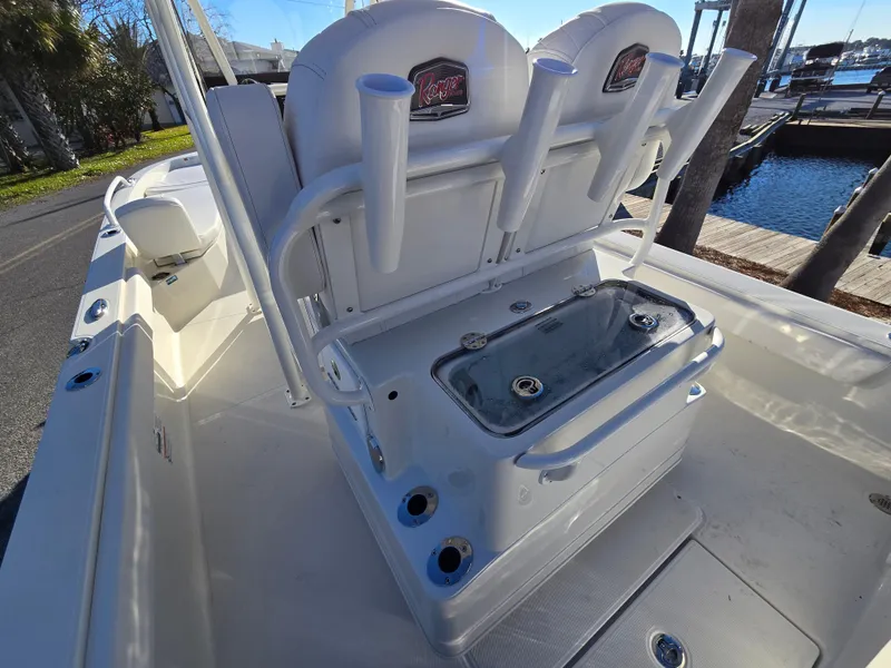 Slide: The Image of 2025 Ranger 2360 Bay boat interior with seating and storage compartments. - 13