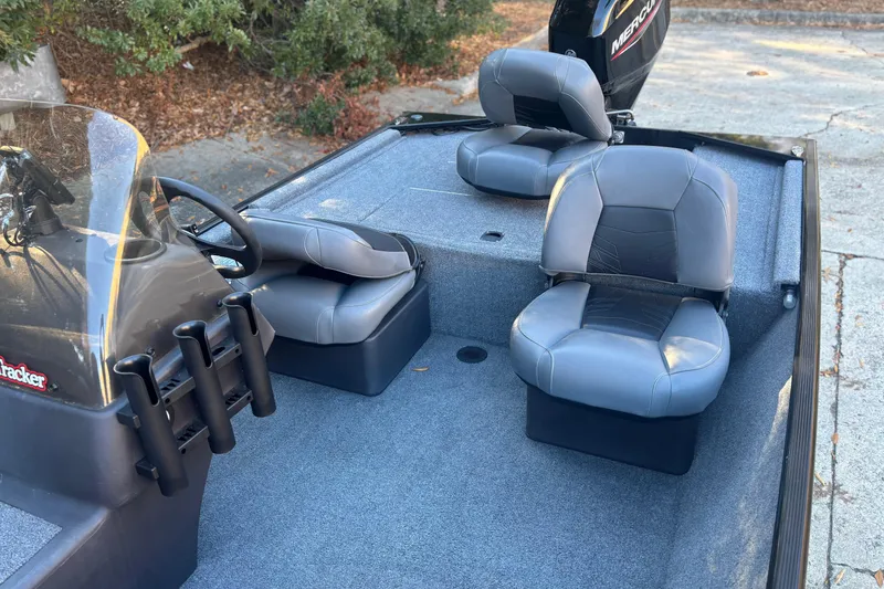 Slide: The Image of 2023 Tracker Bass Tracker Classic XL boat interior with gray seating and steering console. - 6