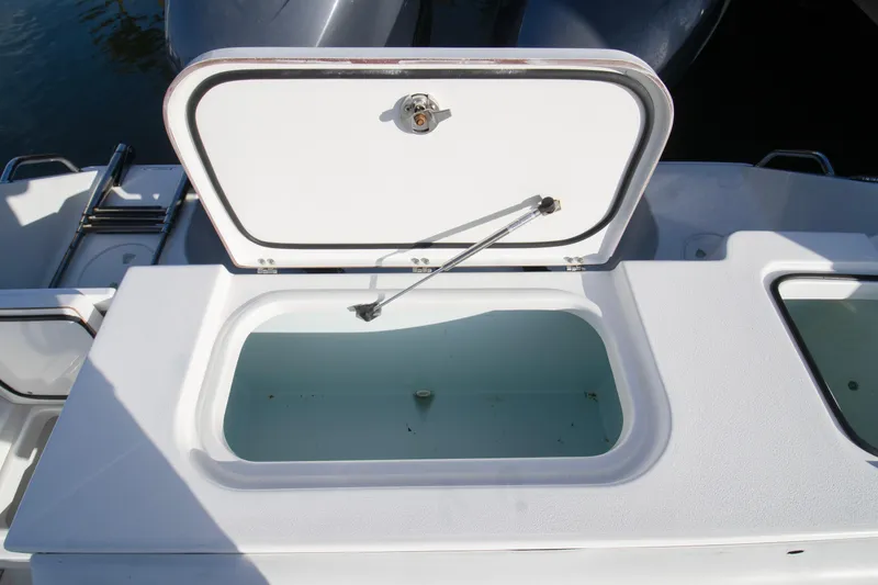 Slide: The Image of Open storage compartment on 2014 Sea Hunt Gamefish 25 boat. - 13