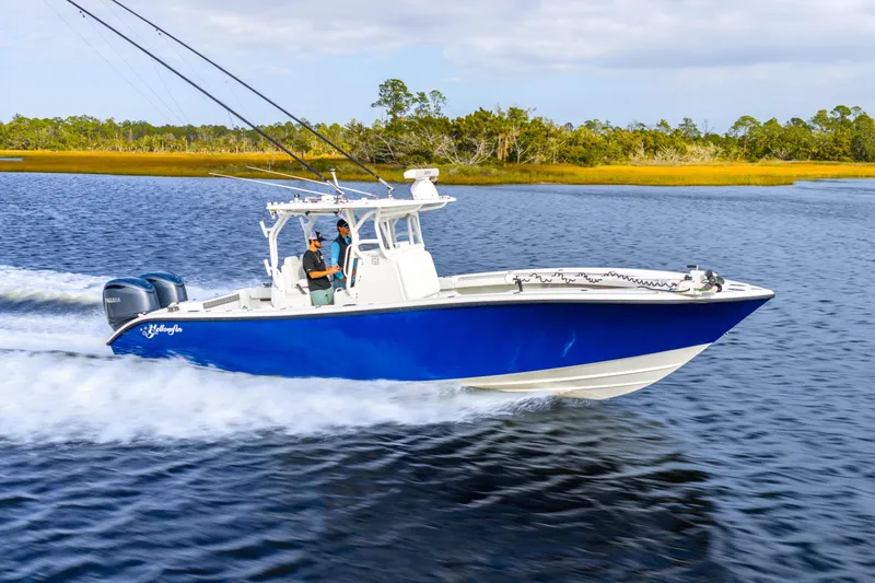 The Image of 2014 Yellowfin 32 Offshore boat cruising on a scenic waterway. - 1