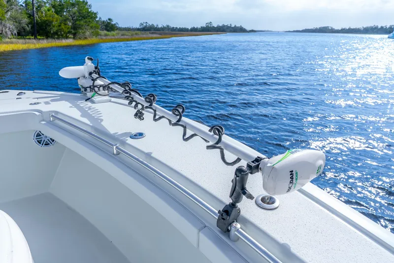 Slide: The Image of 2014 Yellowfin 32 Offshore boat on serene water with clear blue sky. - 18